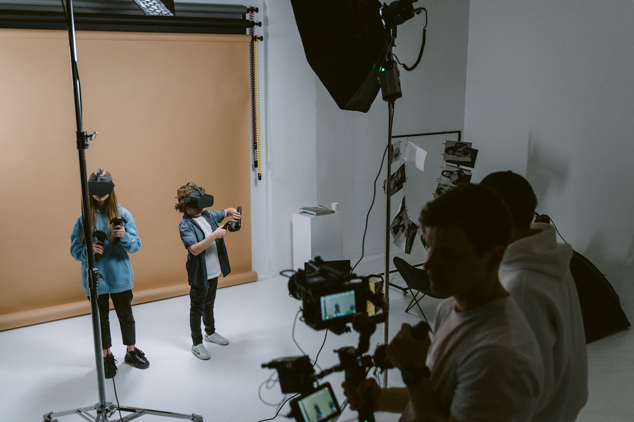 Children exploring virtual reality in a professional photo studio setting.